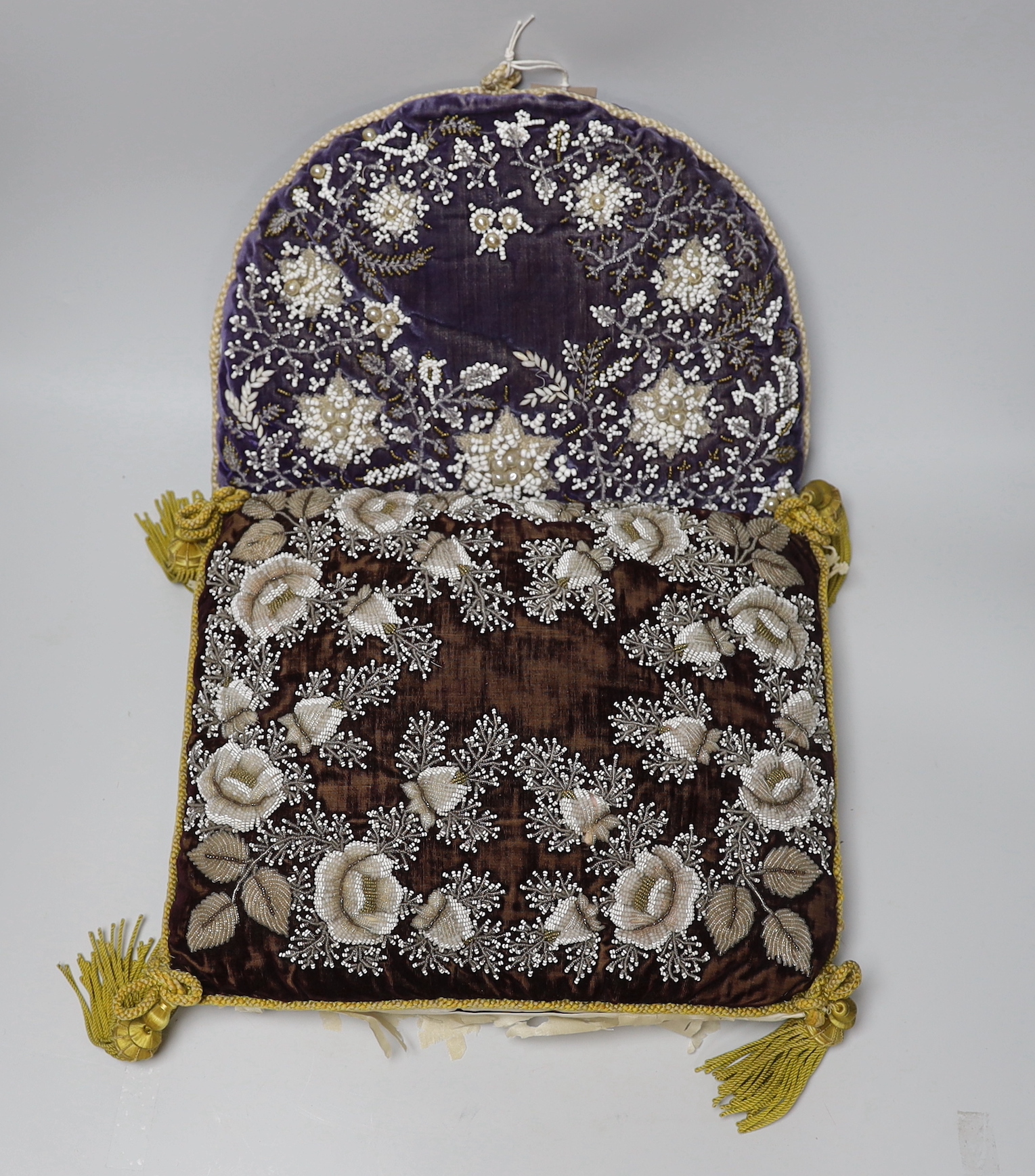 A Berlin-type late 19th century cushion and tea cosy with floral beadwork embroidery, the largest 35cm wide